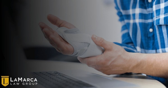 worker holding wrist