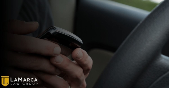 driver with a phone in their hands